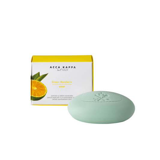 Green mandarin soap bar with packaging on a white background