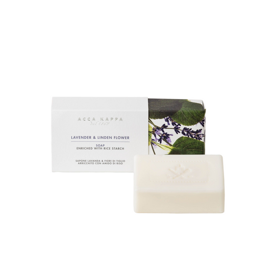 Bar of soap with packaging featuring lavender and linden flower design on a white background