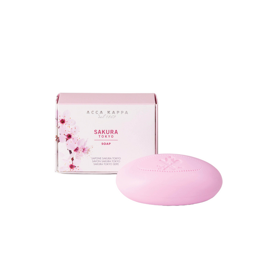 Pink soap bar with Acca Kappa packaging featuring cherry blossoms on a white background