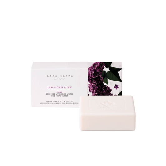 Bar of soap with a card featuring a floral design on a white background